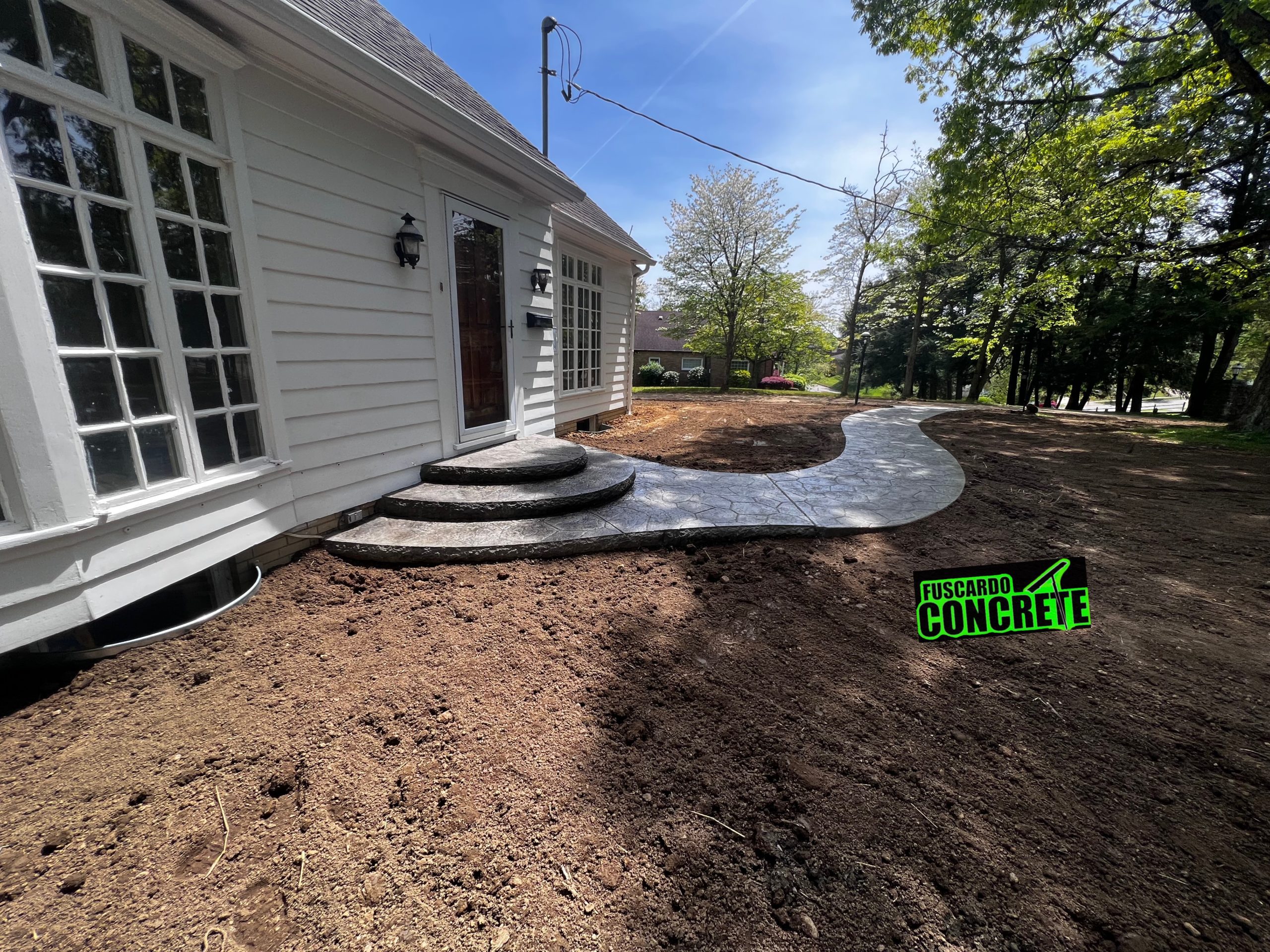 New sidewalks and French Drains at House on Marland Heights